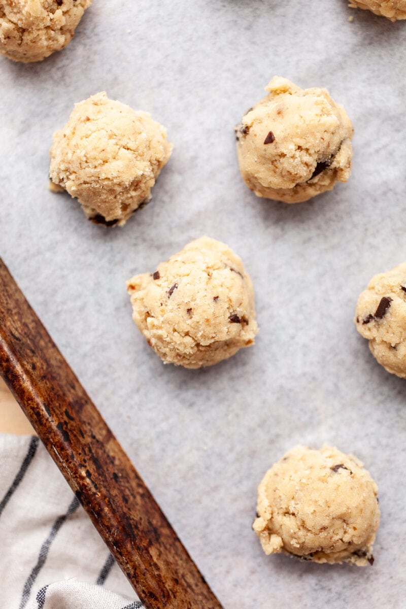 Raw Soft & Chewy Coconut Flour Chocolate Chip Cookie Dough Portions on a cookie tray