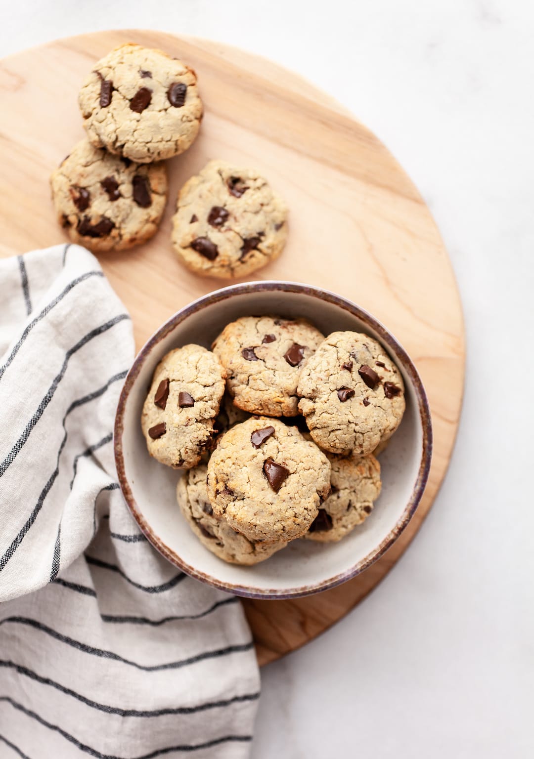 Soft & Chewy Coconut Flour Chocolate Chip Cookies In a Bowl on a Wood Platter