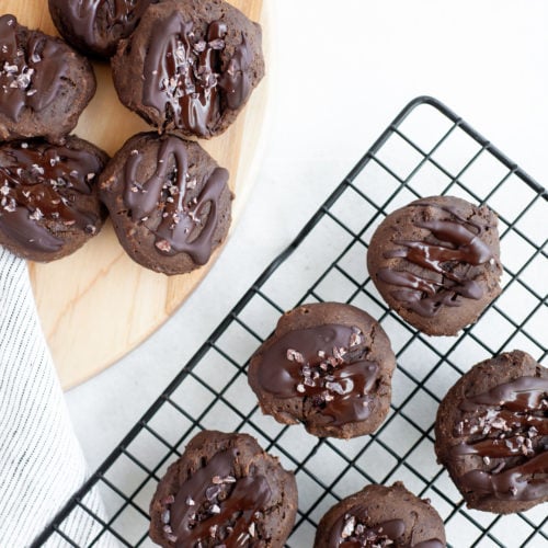 This easy and tasty recipe for healthy double chocolate cookies is super simple, dairy free, and has a gluten free option. Made with whole grains, cocoa powder, dark chocolate, and raw honey, they are a perfect sweet snack that’s soft, pillowy, chewy and low calorie.