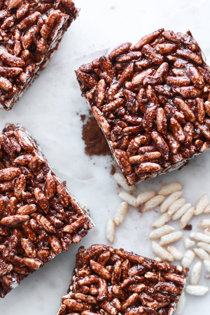 healthy rice krispie treats with cocoa scattered on parchment