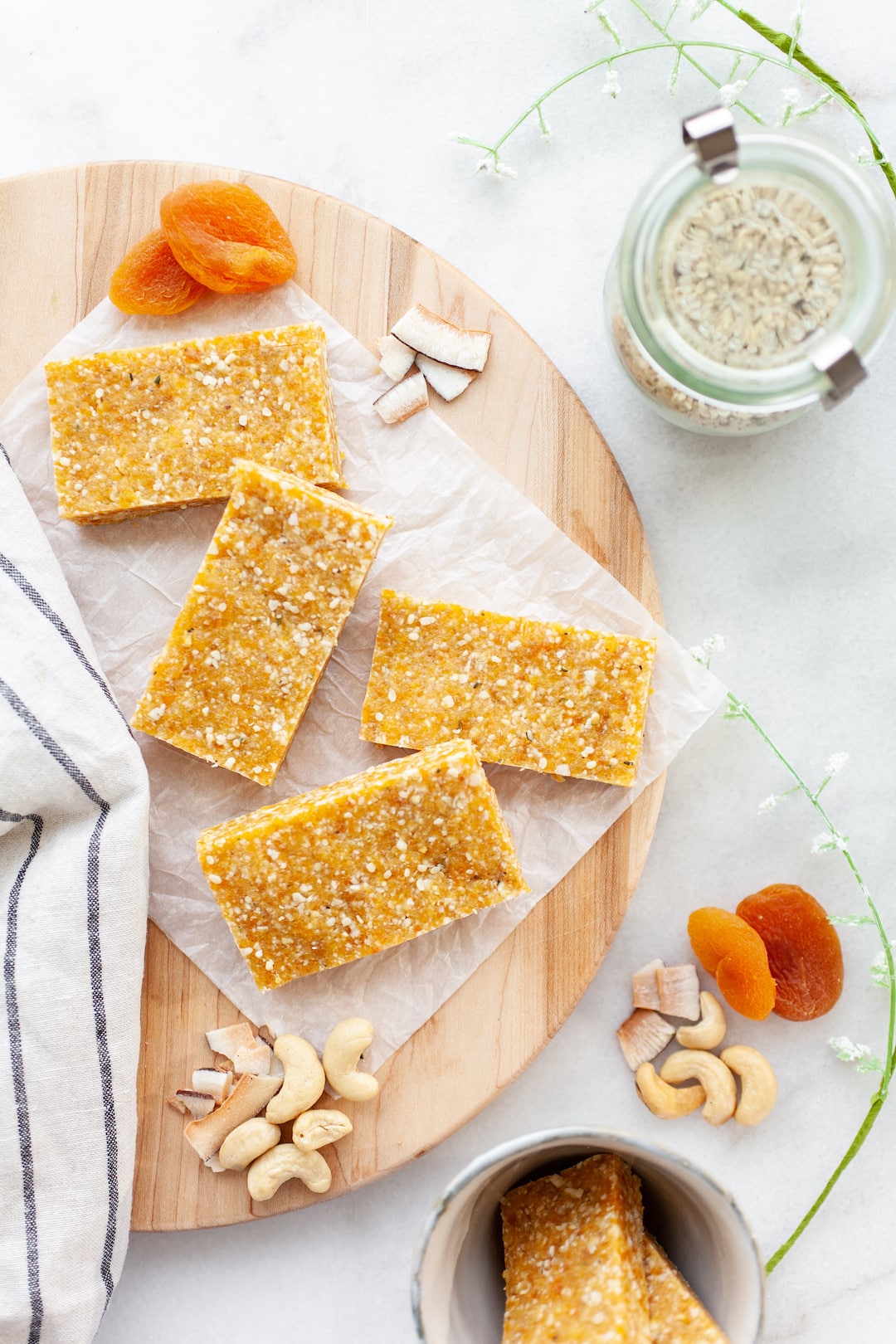 Apricot Cashew Energy Bars on a wood board