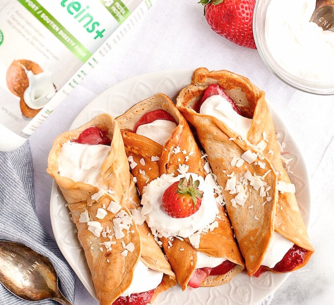 Healthy Protein Crepes on a plate with a protein powder container beside