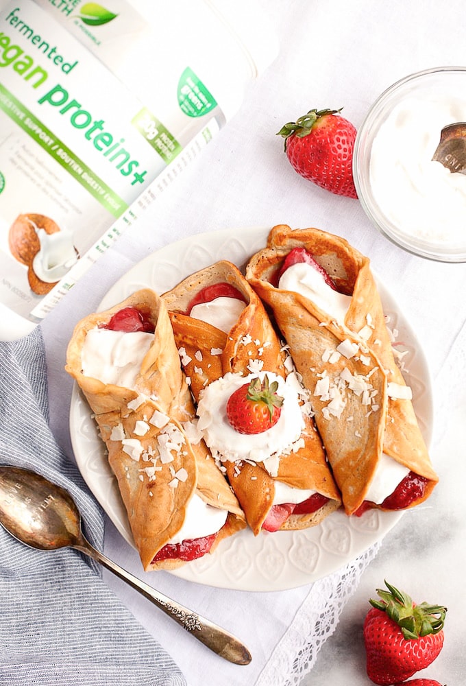 Healthy Protein Crepes on a plate with a protein powder container beside