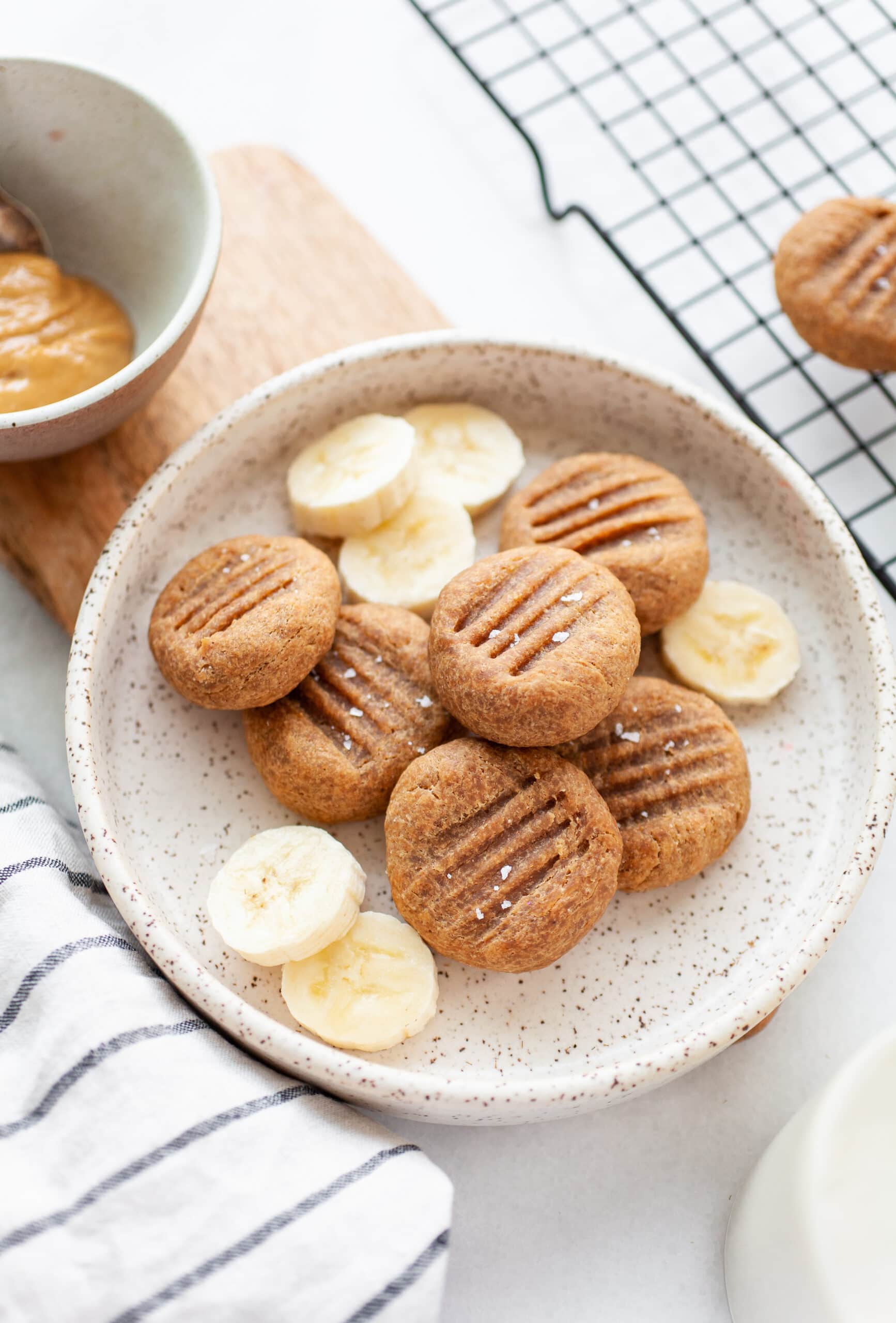 Healthy Peanut Butter Banana Cookies on a plate with banana slices