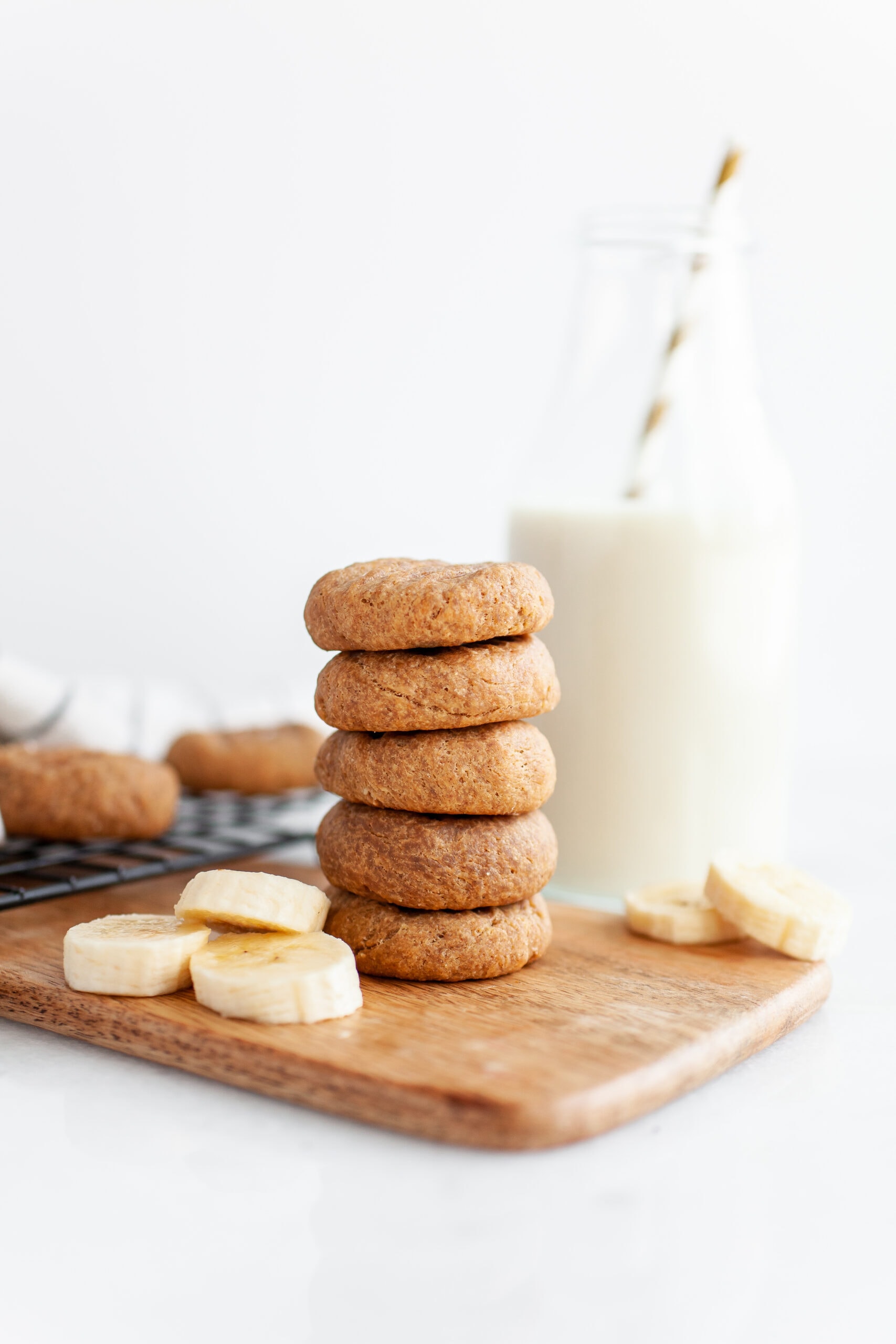 Stack of Healthy Peanut Butter Banana Cookies with a glass of dairy free milk