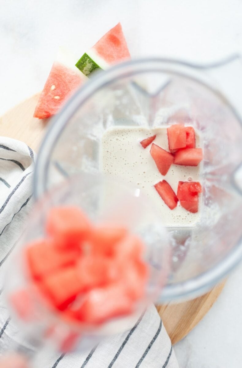cashew milk base with watermelon chunks in a vitamix blender canister