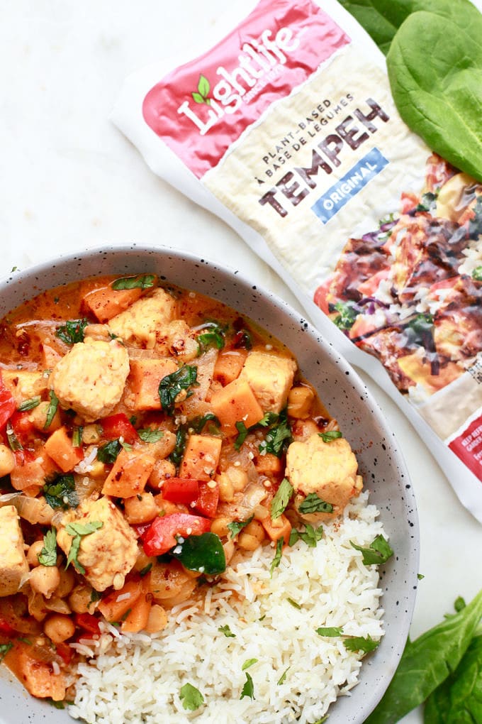 This delicious and easy recipe for Thai Red Curry stew is so perfect for any day of the week. It’s vegetarian, can be easily made vegan, full of vegetables and tempeh and made with coconut milk. It’s also gluten free, can be served with rice, quick and simple…less than 30-minutes to dinner! 