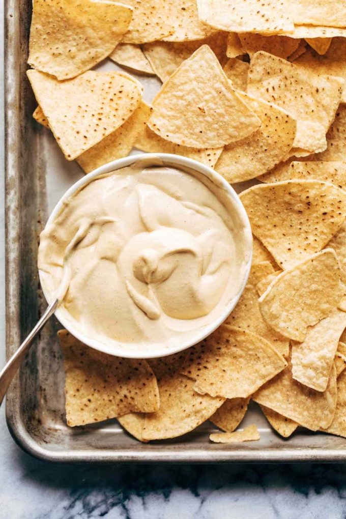11 Delicious Dairy Free Cheese Recipes To Make | Easy Vegan Queso In A Bowl | Try these 11 delicious and easy dairy free cheese recipes that won’t make you miss the real thing! They are gluten free, made with all kinds of great dairy free ingredients like cashews and coconut milk! Whether you are craving nacho cheese sauce, fondue, a cheese ball, cream cheese, queso, mozzarella, or jalapeño cheese, there’s a vegan option for every one - comfort food at it’s finest! 