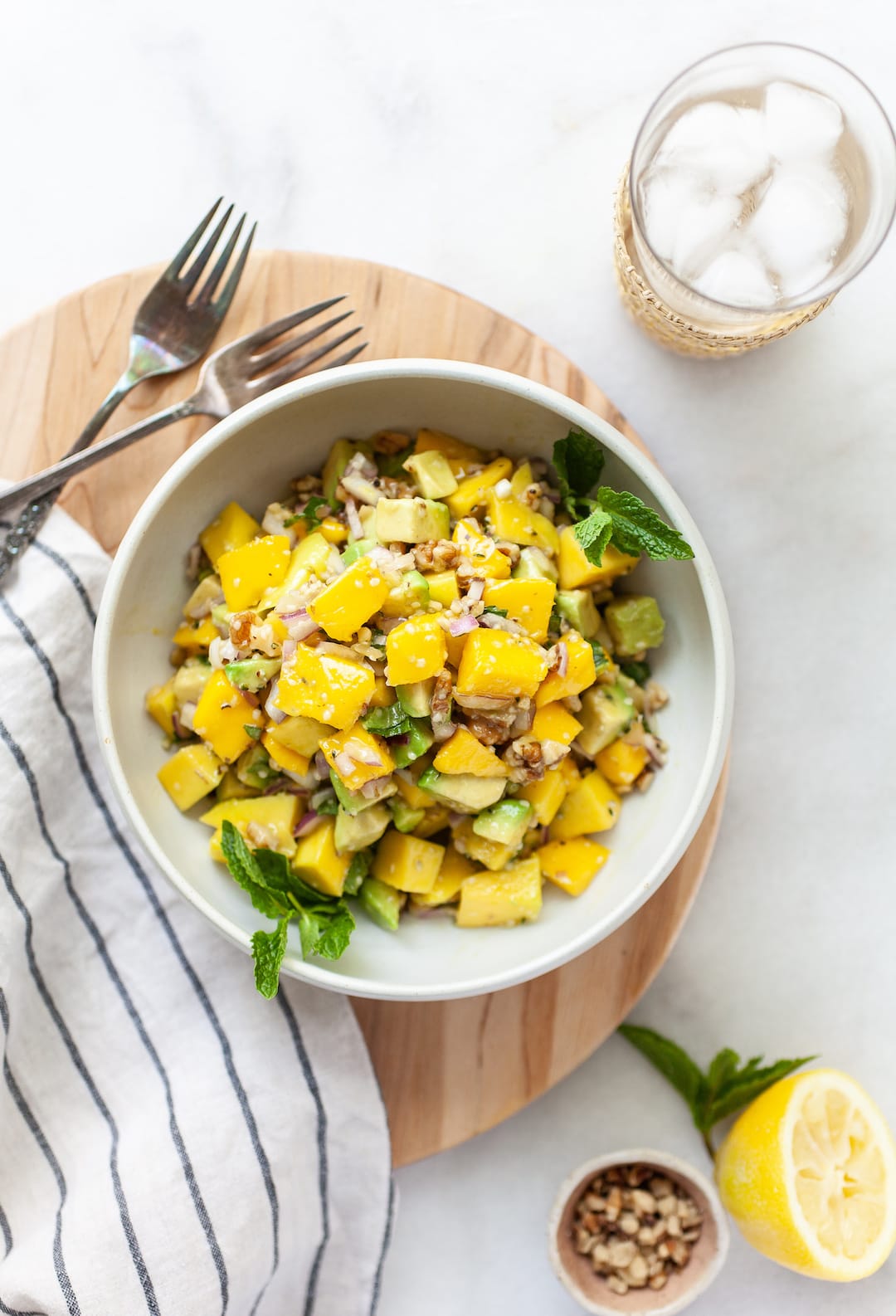 Easy Mango Avocado Salad overhead view in a bowl with forks on the side