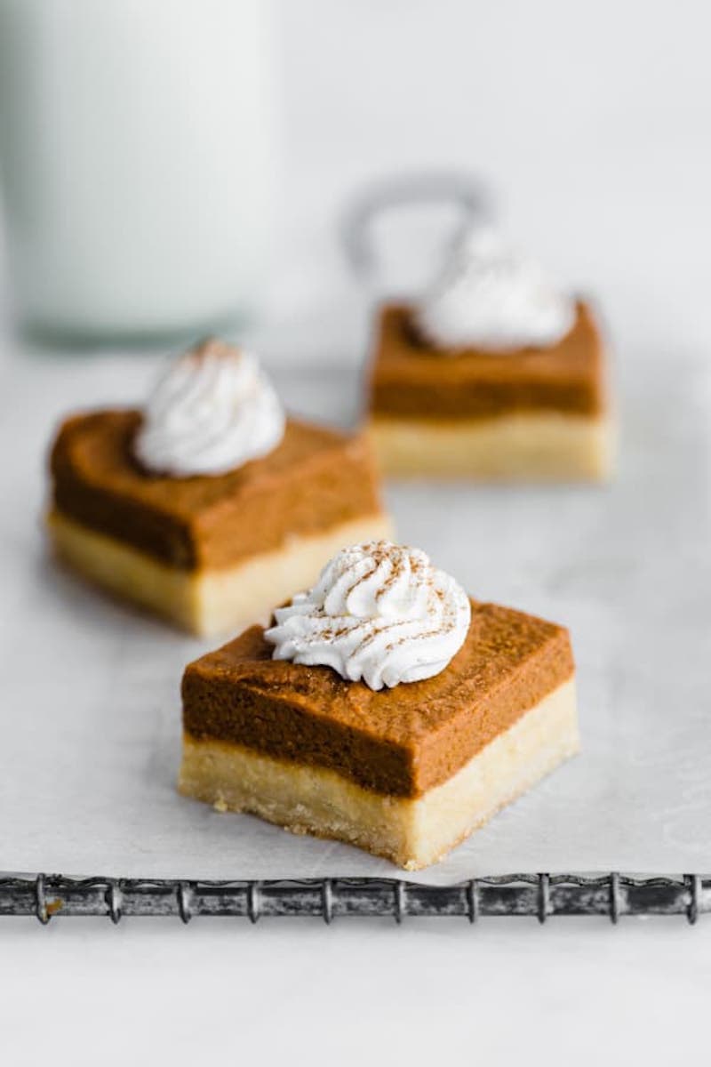 9 Drool-worthy Gluten Free, Dairy Free Pumpkin Pie Recipes - Pumpkin Pie Bars with Almond Cookie Crust from Choosing Chia