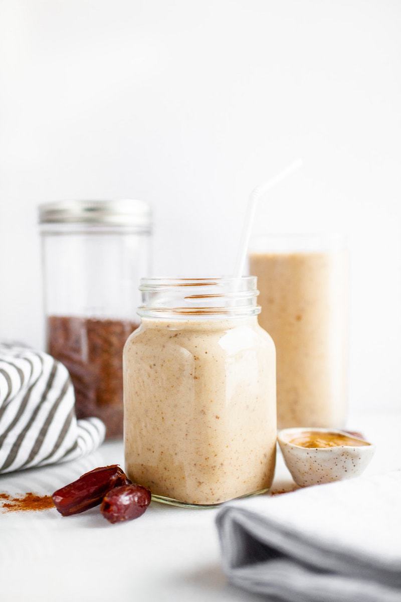18 Easy Plant-Based Snacks To Try - Banana Almond Butter Date Smoothie