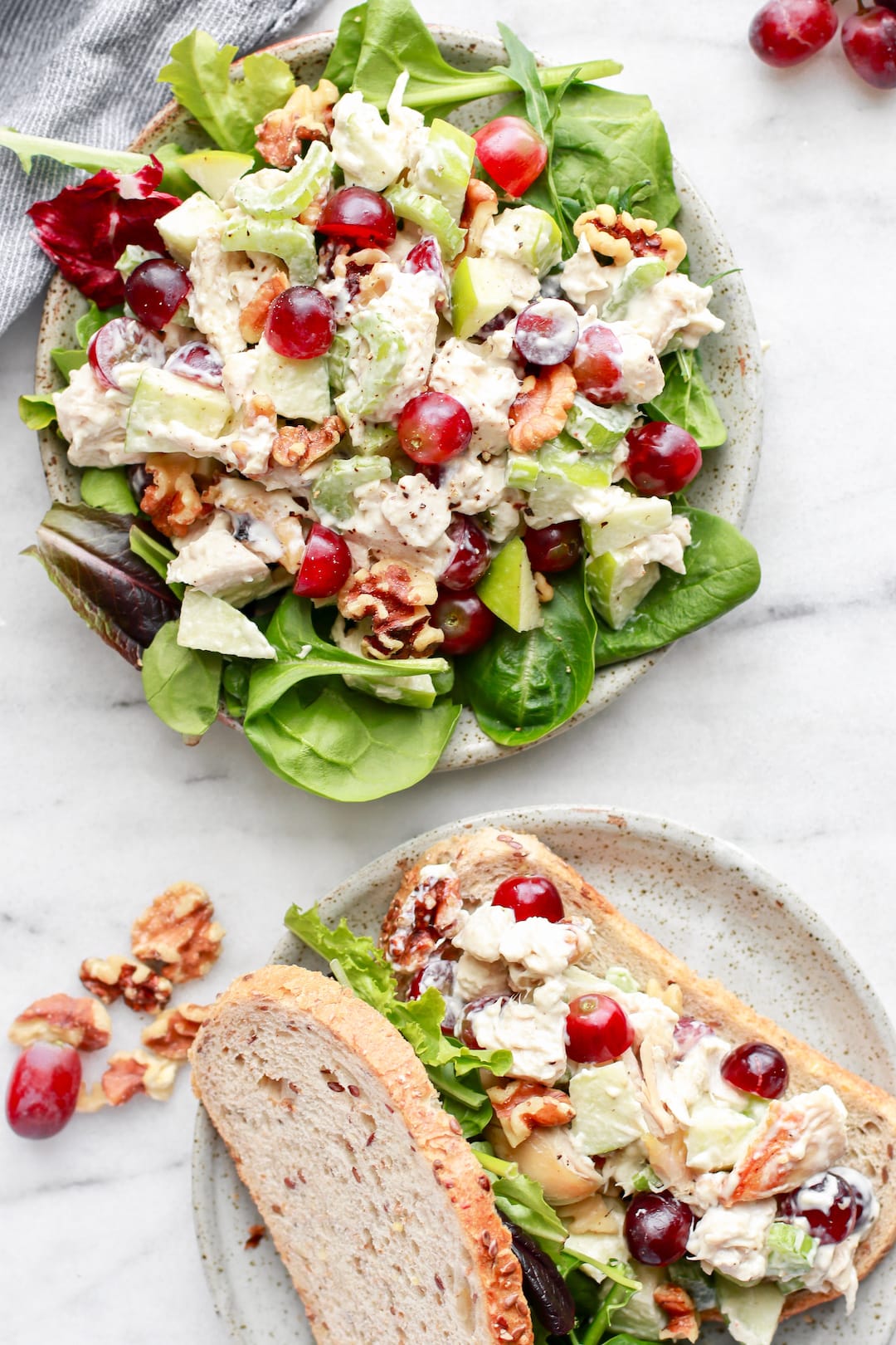chicken salad with grapes and lettuce on a large plate