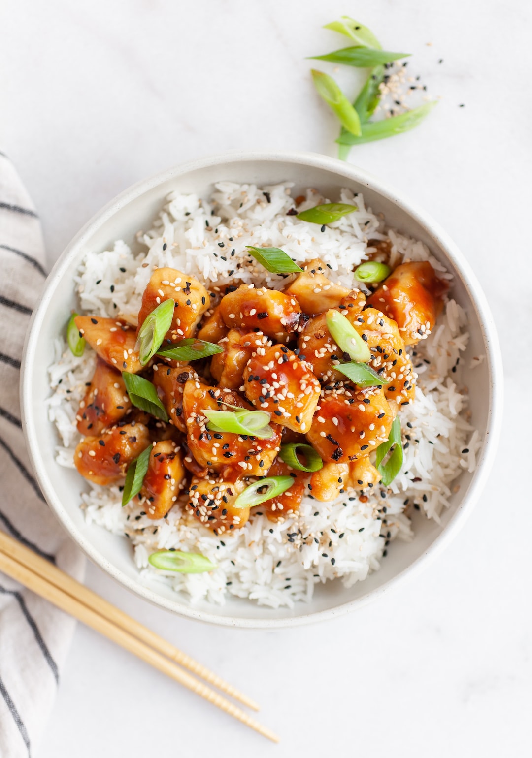 orange chicken in a bowl with white rice