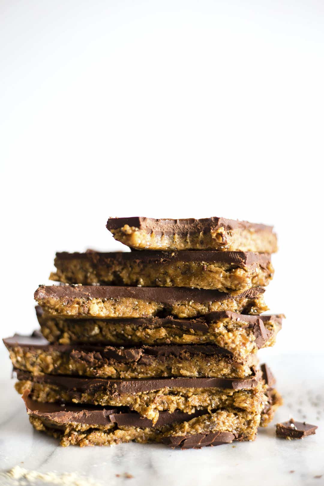 stack of almond butter paleo protein bars with chocolate