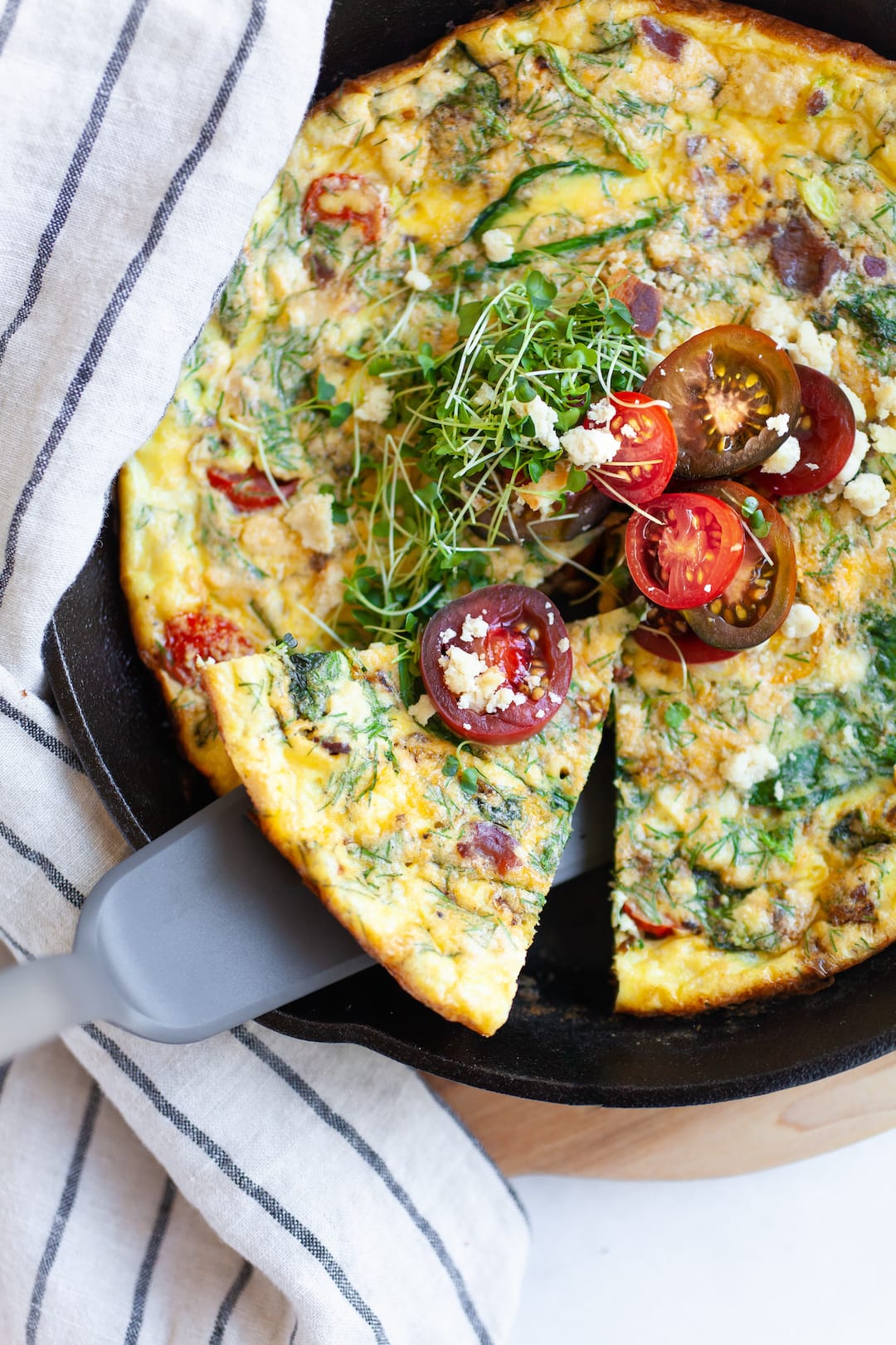 Slice of dairy free frittata in a skillet