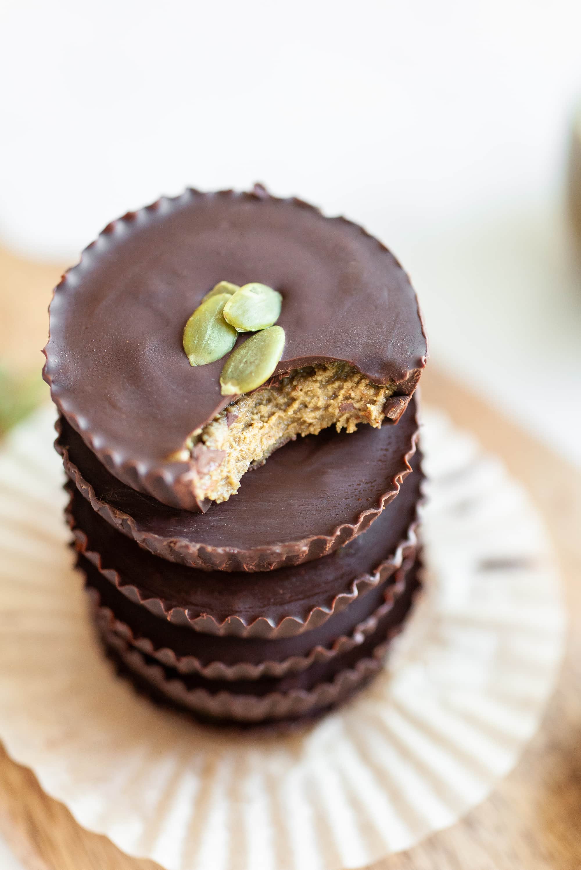 close up of chocolate pumpkin seed butter cups