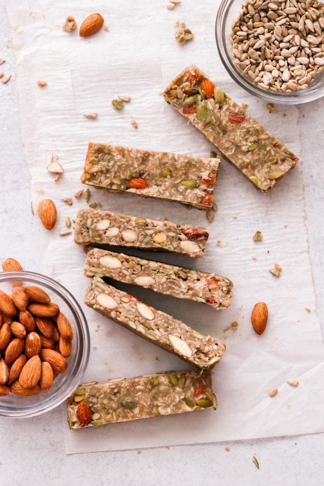 paleo protein bars on a tray with almonds