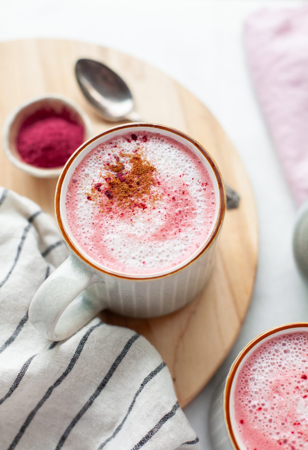 Close up of pink beetroot latte in a mug