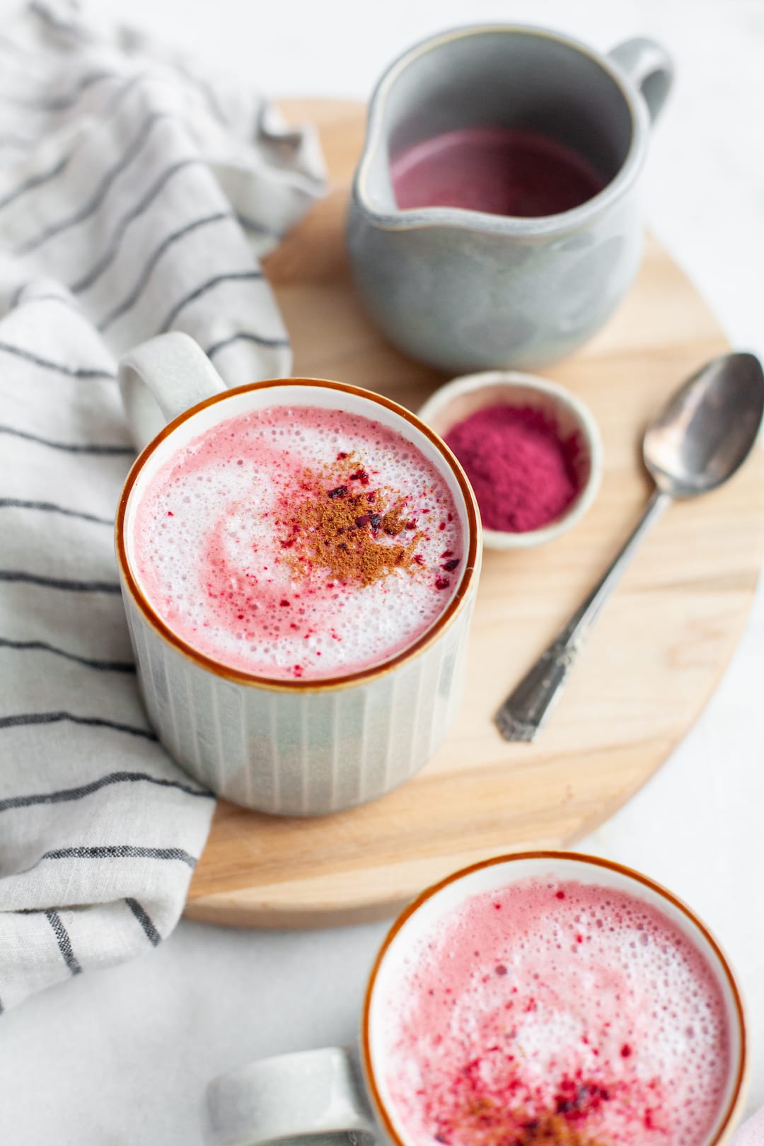 Beetroot latte in a mug with beet powder