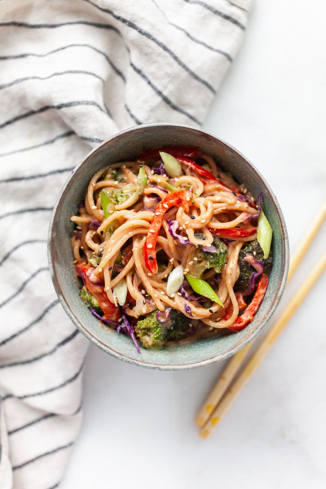 Delicious and healthy bowl of peanut sauce noodles and vegetables 