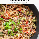 peanut sauce noodles in a large pan with vegetables