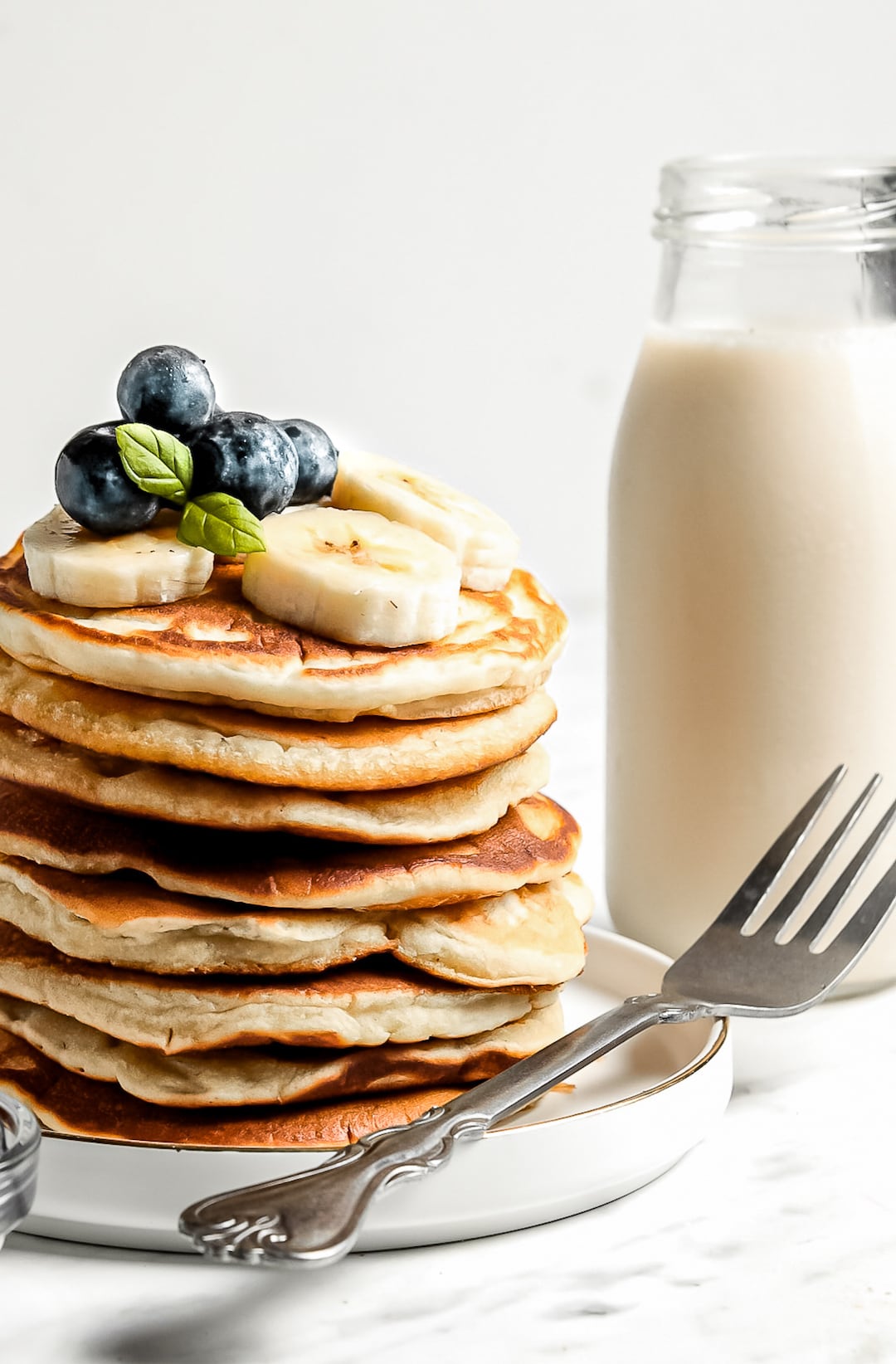 Close up stack of Healthy Cassava Flour Pancakes with blueberries and banana