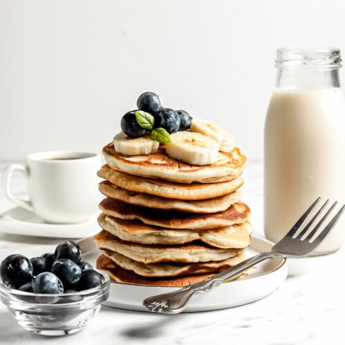 Healthy Cassava Flour Pancakes stacked with blueberries and banana
