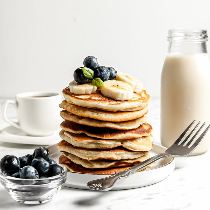 Healthy Cassava Flour Pancakes stacked with blueberries and banana