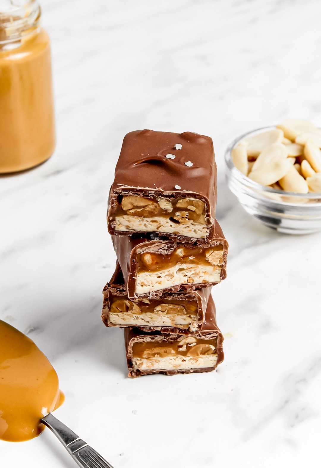 Stacked Must-Make Healthy 'Snickers' Protein Bars with peanuts and caramel