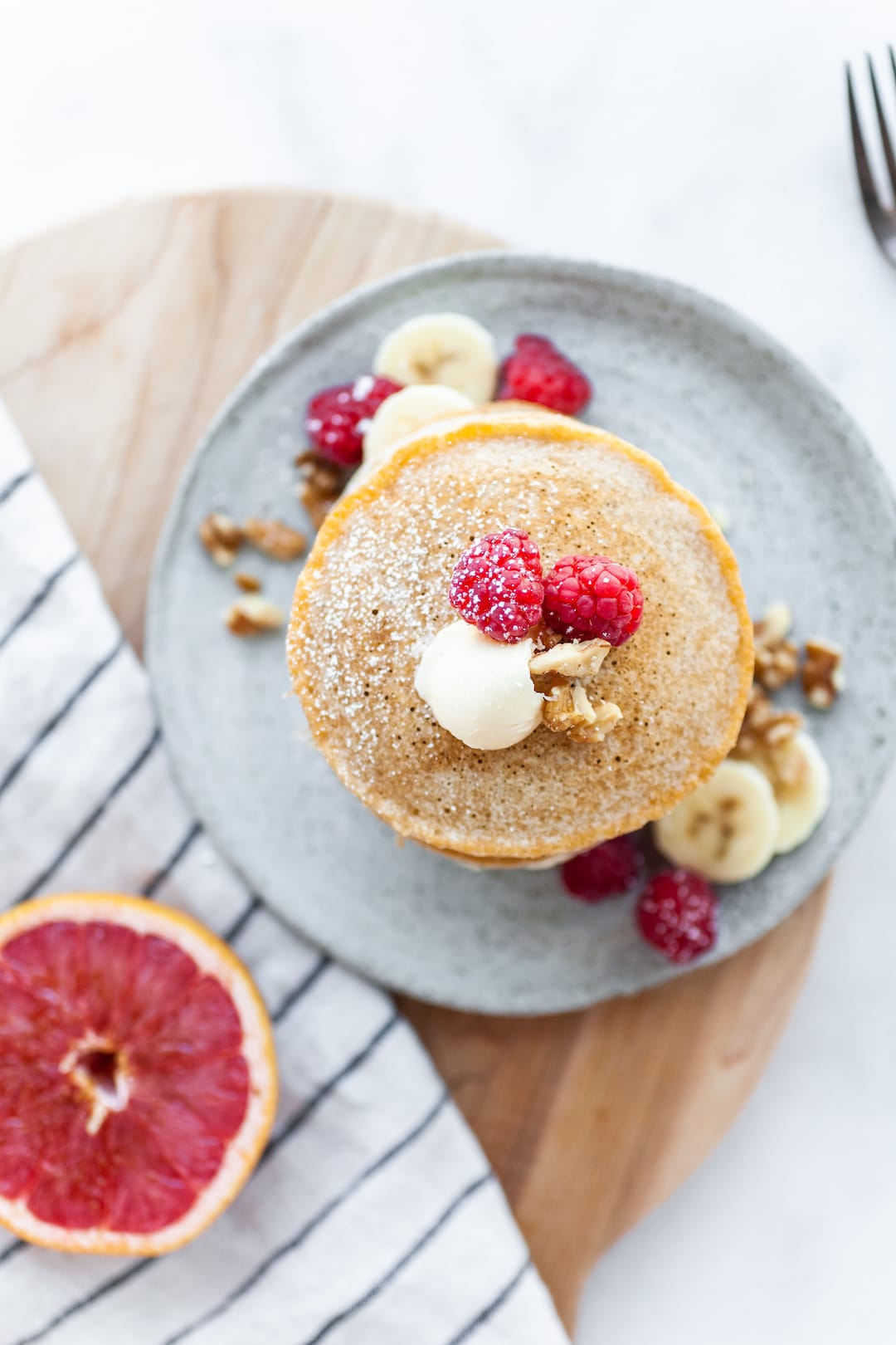 Perfect Vegan Buckwheat Pancakes with raspberry garnish