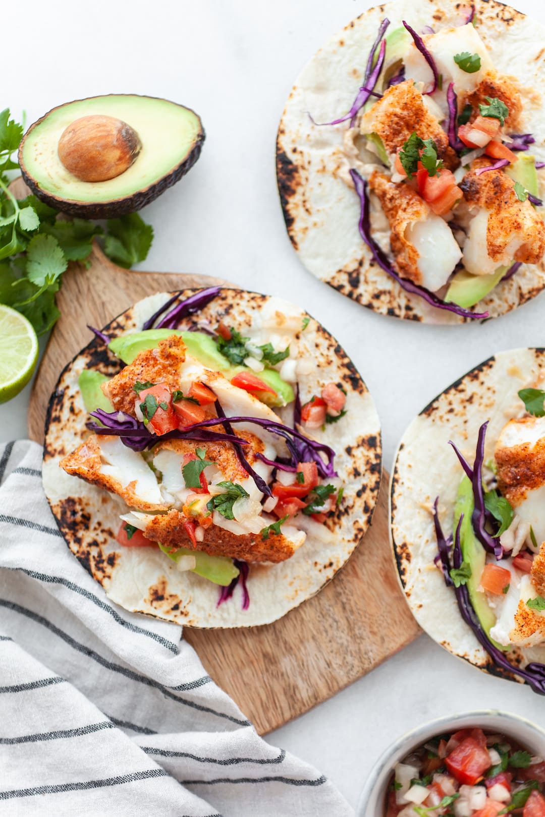 Overhead shot of Healthy Air Fryer Fish Tacos with fresh salsa and avocado