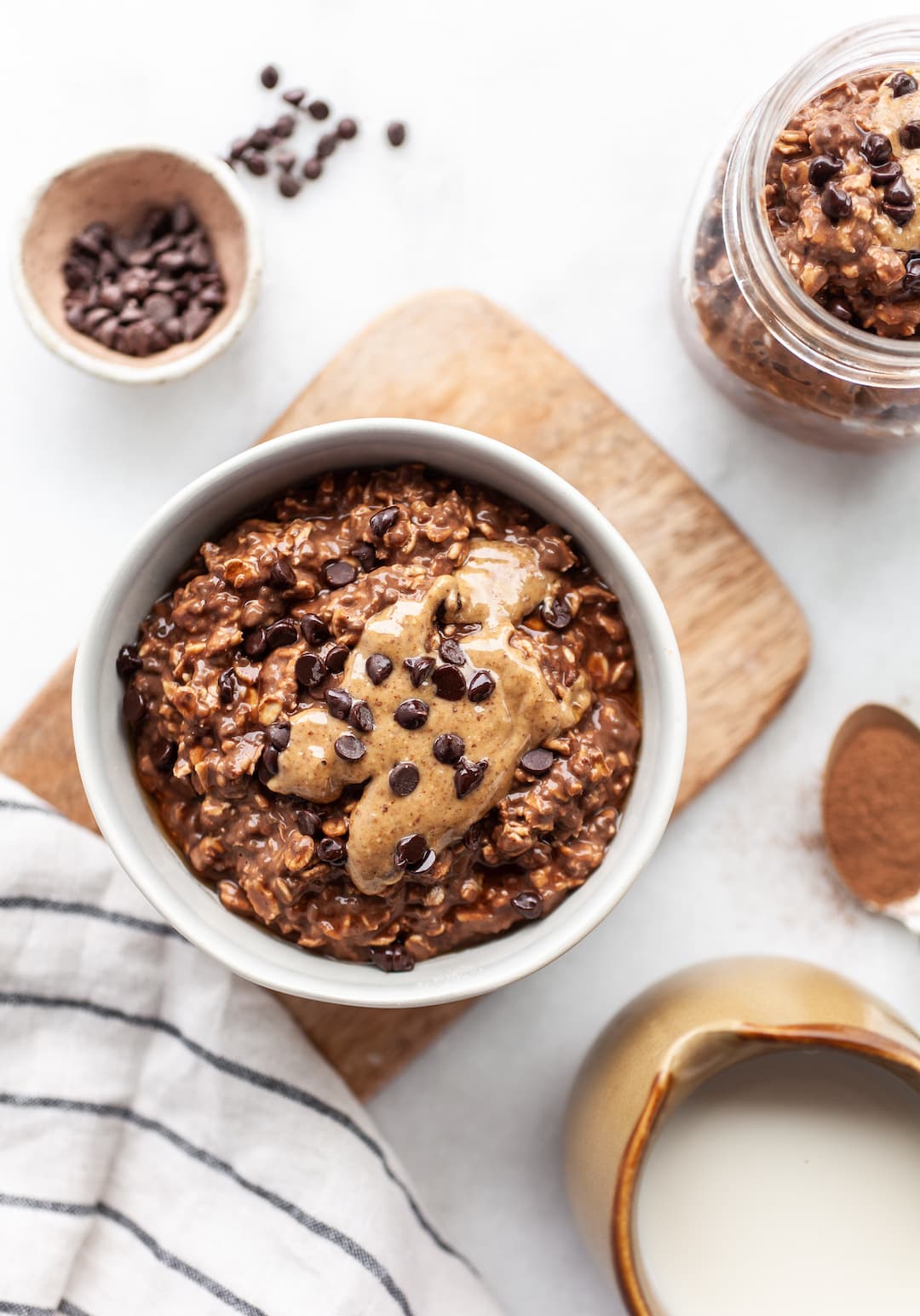 Bowl of Healthy Chocolate Overnight Oats with almond butter and chocolate chips
