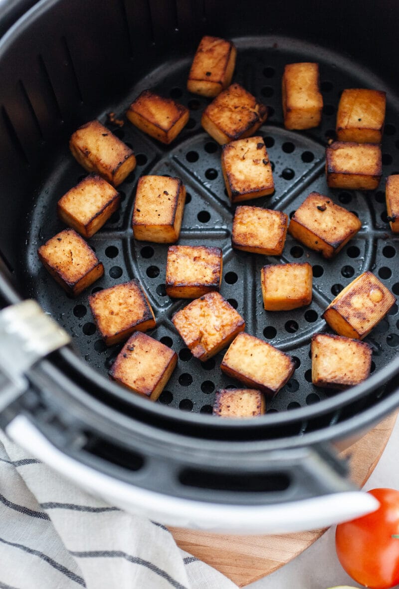 Cooked Crispy Air Fryer Tofu in the air fryer basket