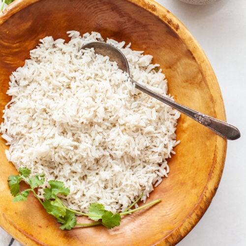 Instant Pot Basmati Rice in a wooden bowl with a serving spoon