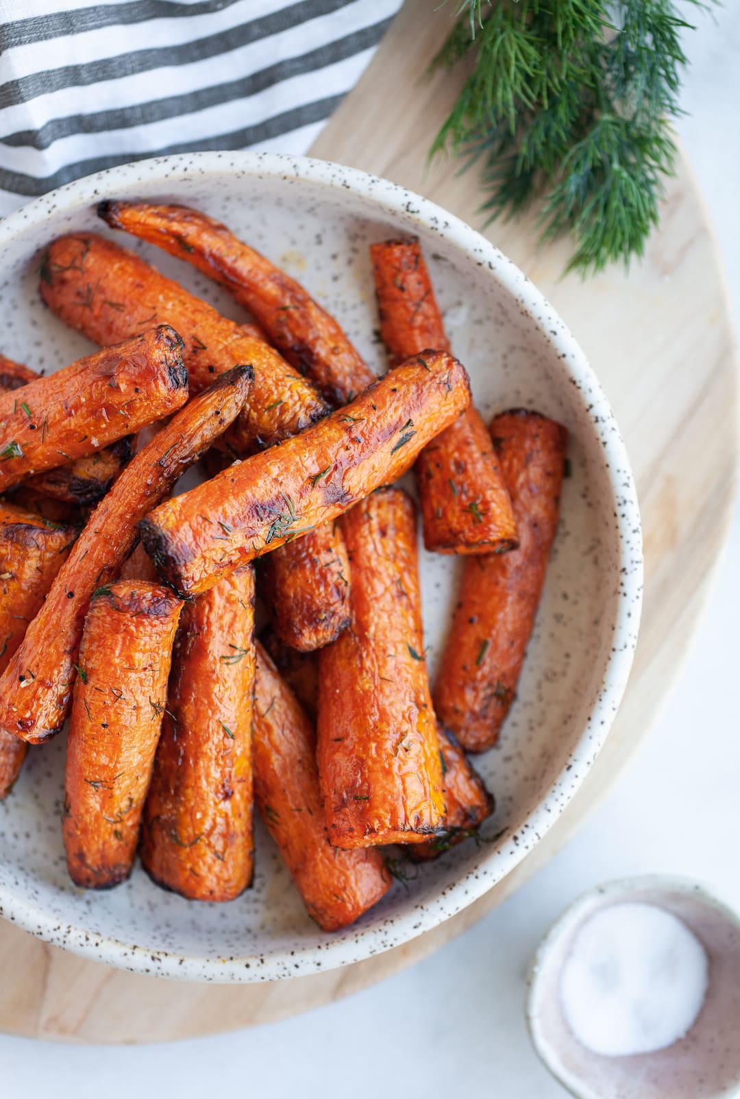 Incredible Air Fryer Carrots on a plate with fresh dill