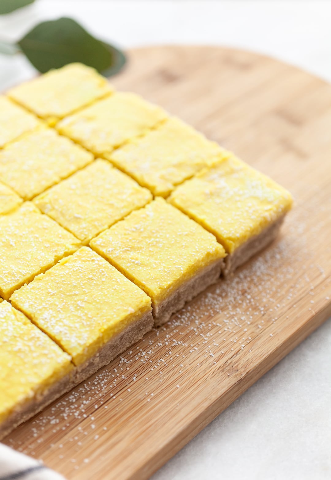 Side view of Best Vegan Lemon Bars cut into squares