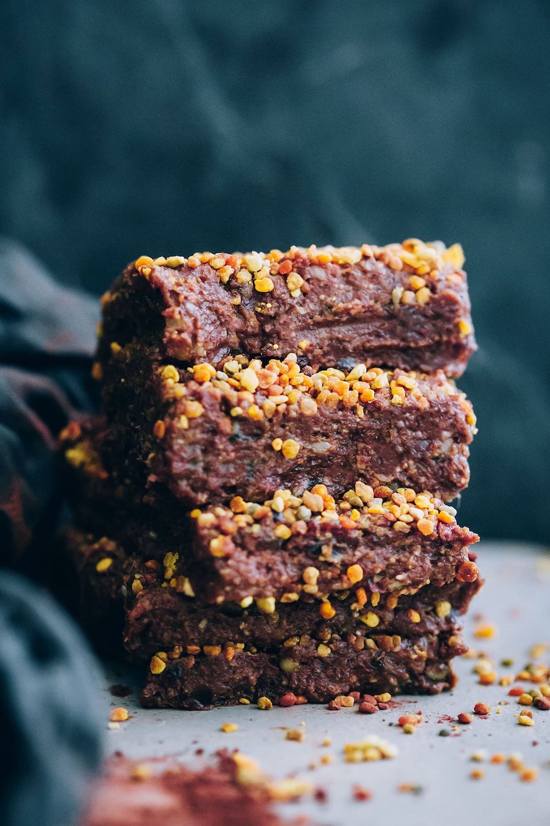 Stack of dark chocolate fudge topped with bee pollen