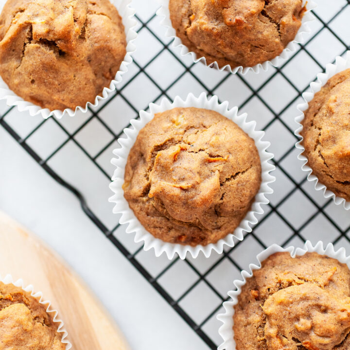close up of banana carrot muffins on a cooling rack