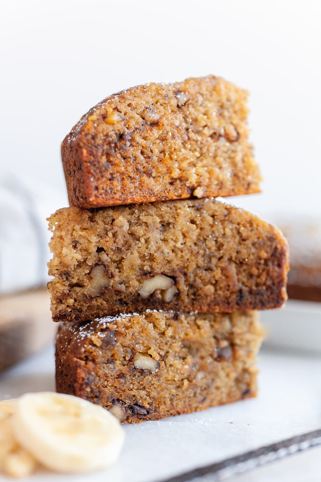Close up of three slices of instant pot banana bread stacked