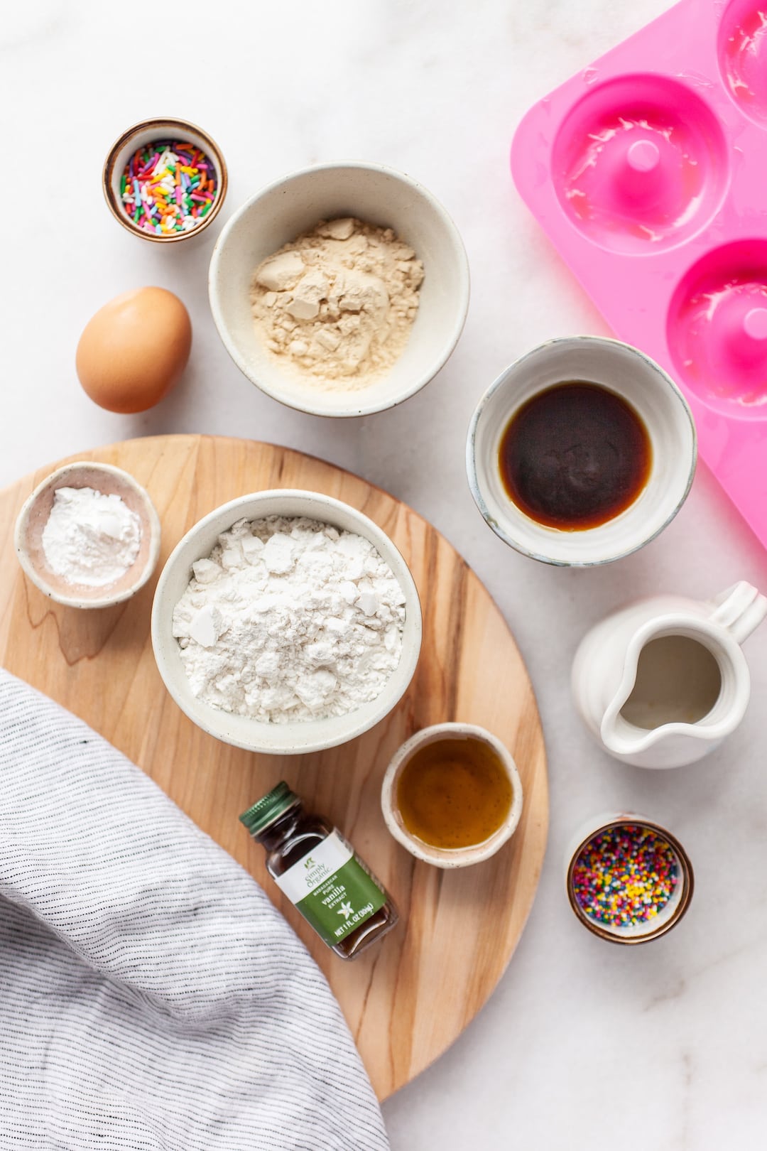 overhead view of flatly of ingredients for simple vanilla protein donuts