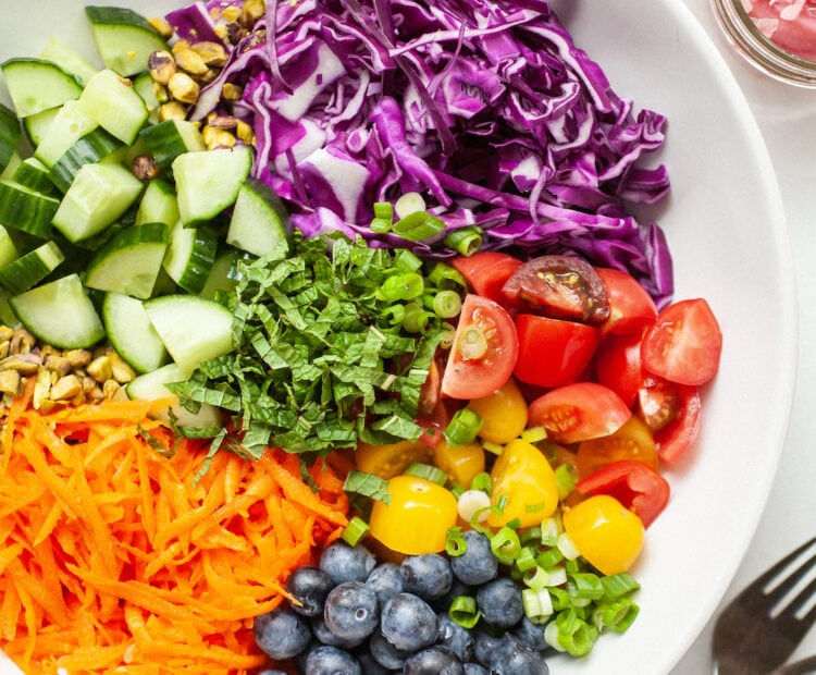 rainbow salad in a large white bowl