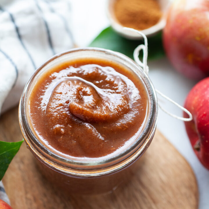 close up of instant pot apple butter in a small glass jar