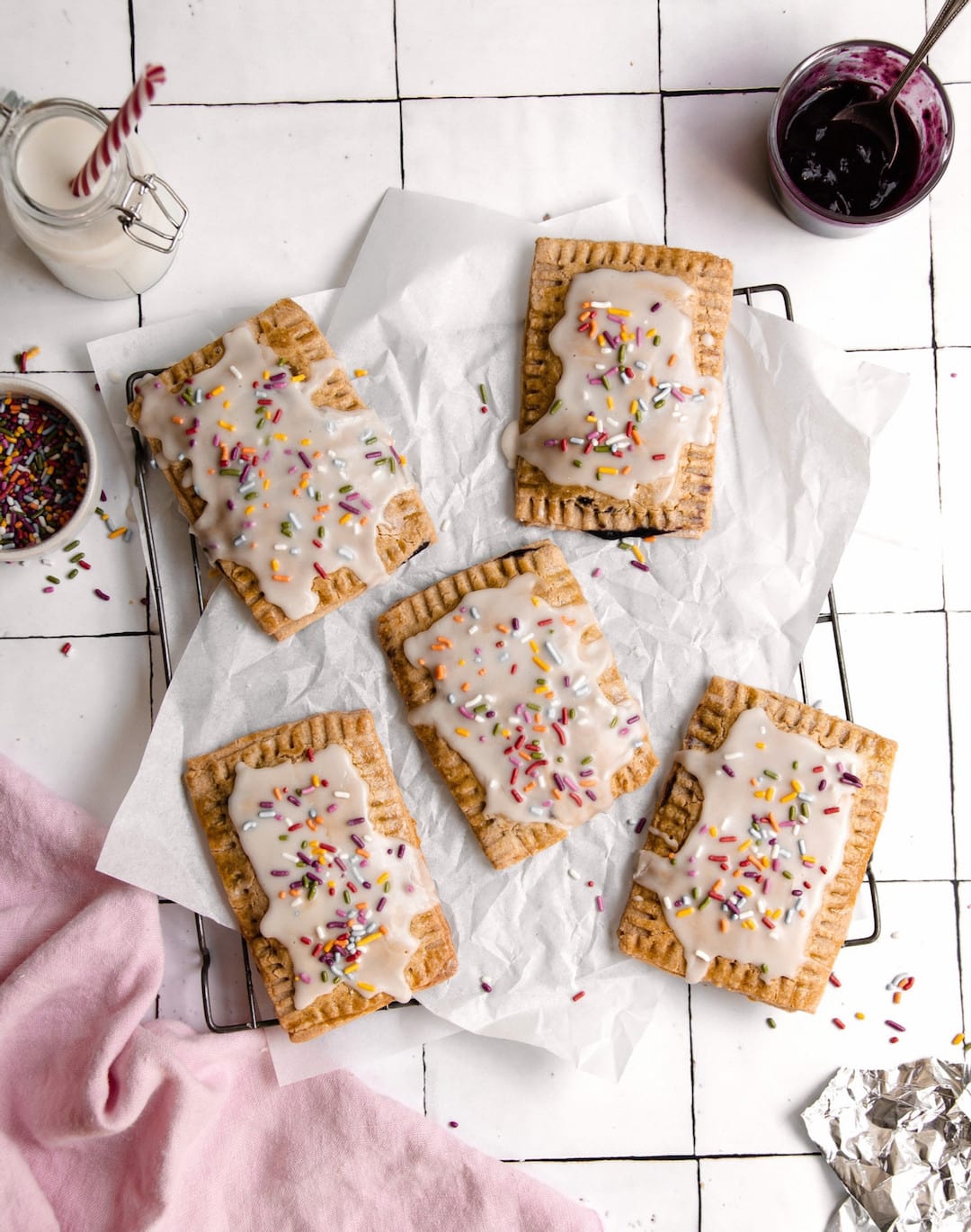 overhead view of vegan gluten free pop tarts topped with vanilla icing and sprinkles 
