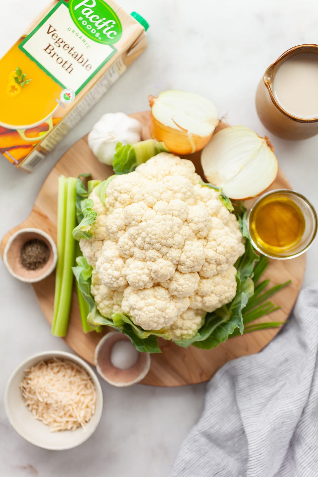 image of ingredients for instant pot cauliflower soup on a wood board