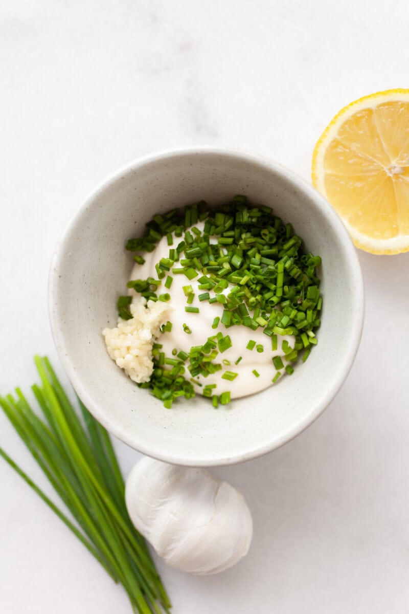 garlic and chive aioli ingredients in a bowl