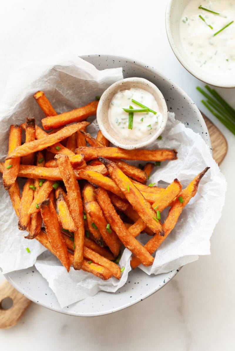 cooked from frozen sweet potato fries in a bowl with aioli dip on the side