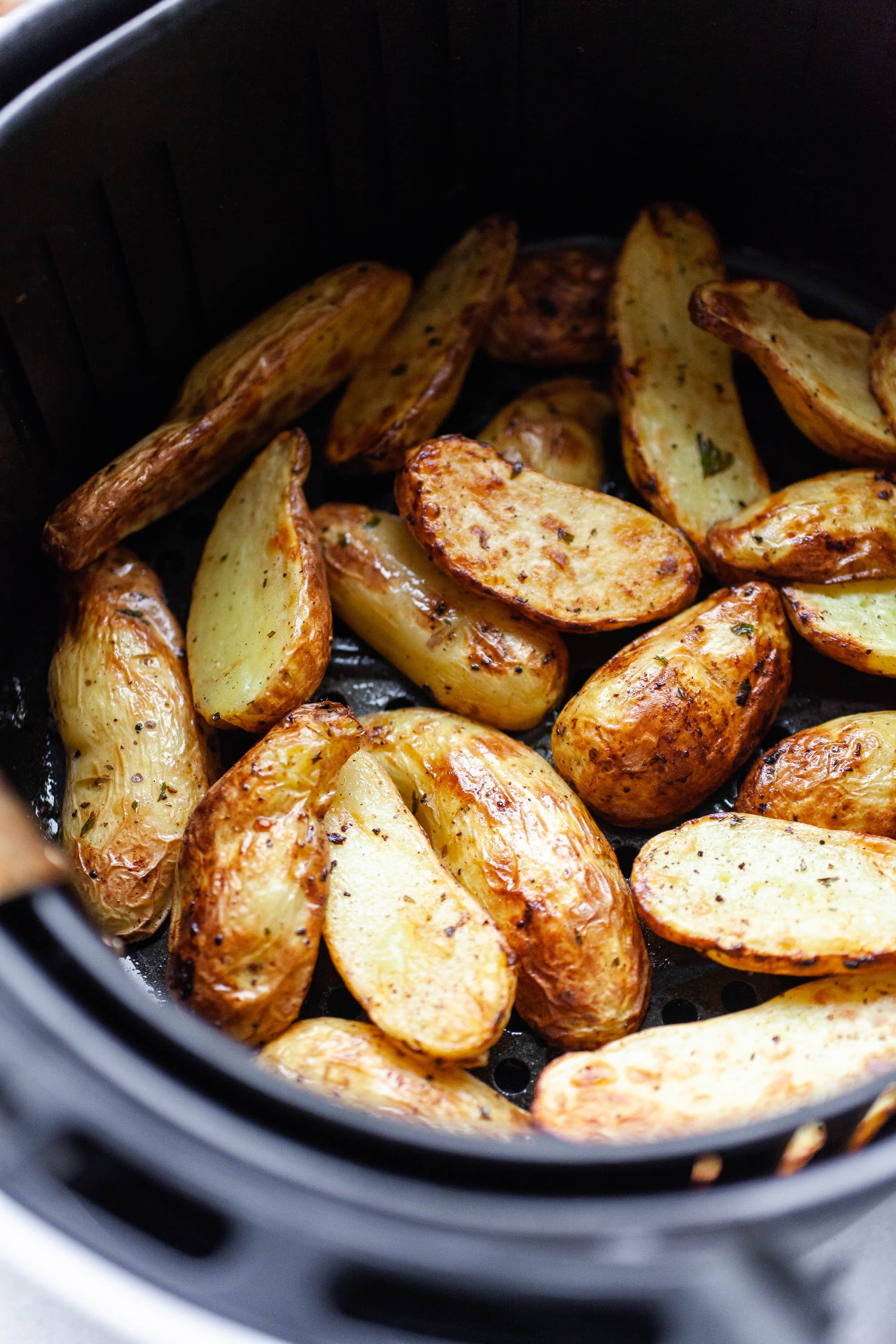 image of an Air Fryer basket filled with Fingerling Potatoes