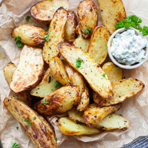 image of cooked air fryer fingerling potatoes in a pile topped with parsley