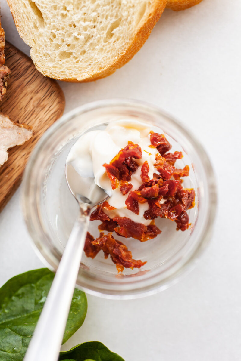 image of a glass jar with mayonnaise and sun-dried tomatoes