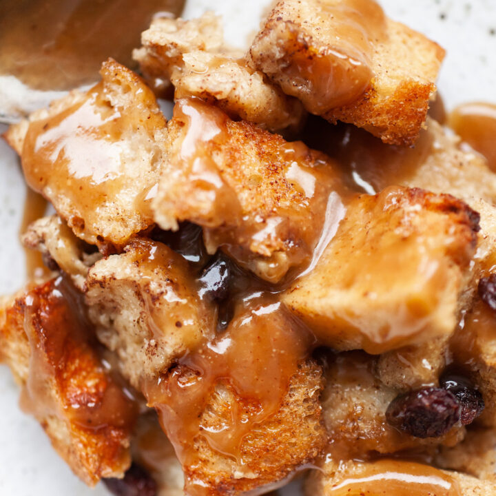 image of gluten free bread pudding up close topped with caramel sauce